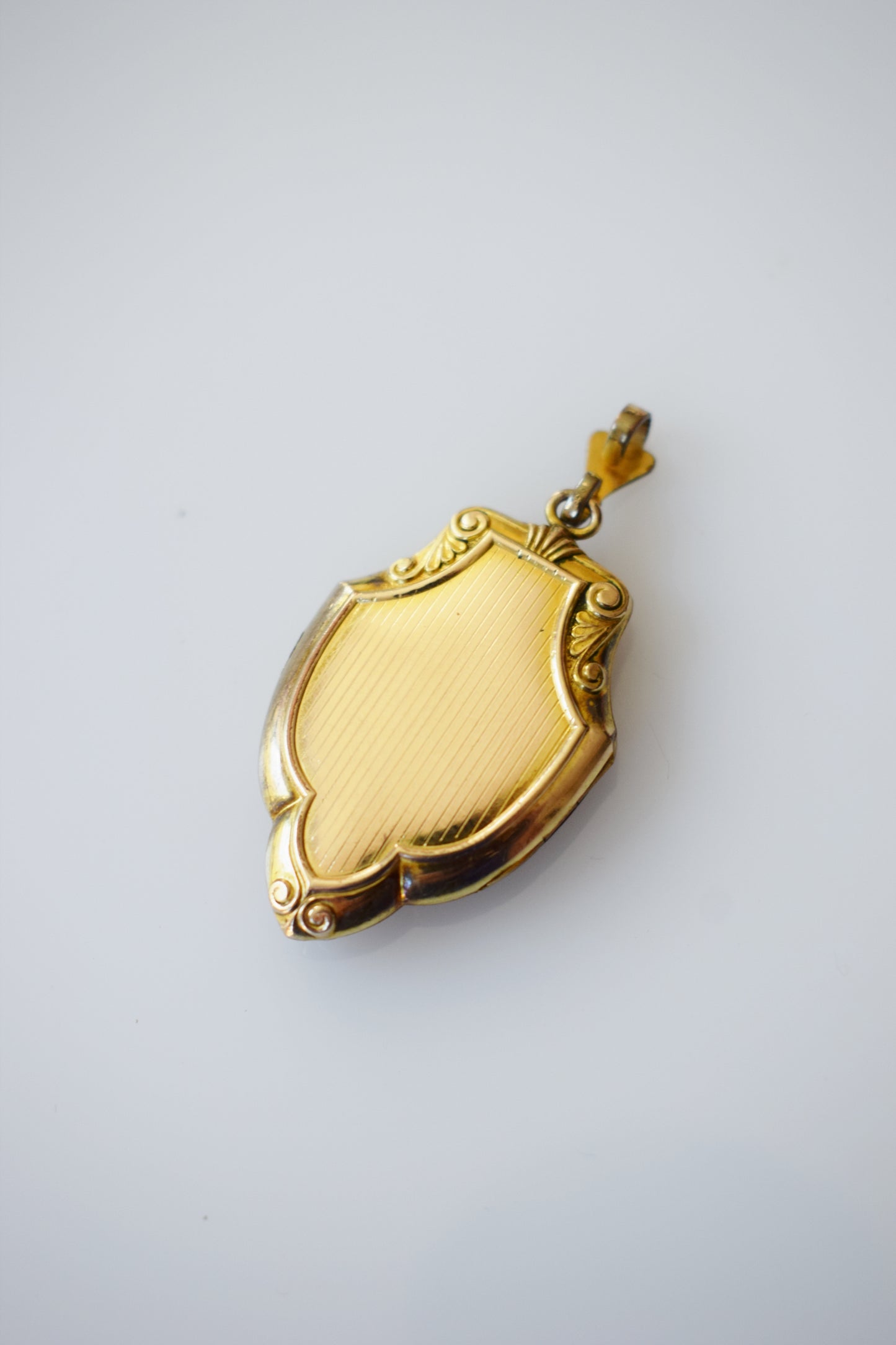 Vintage Gold Shield-Form Locket with Initial "E"