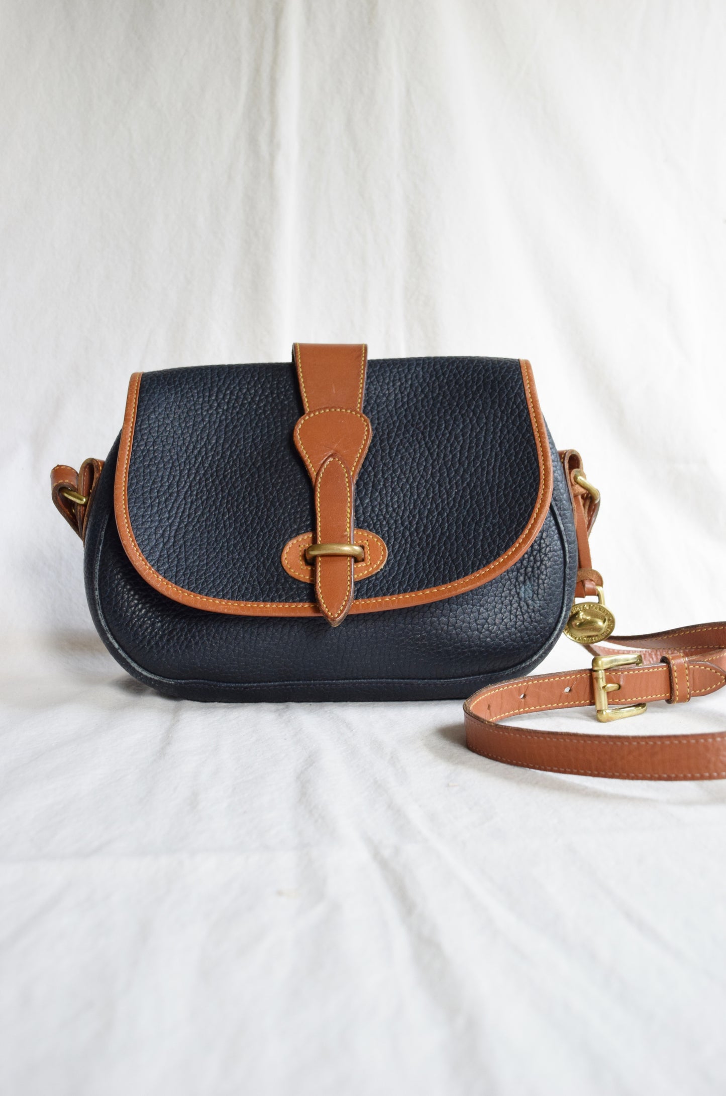 Vintage Dooney & Bourke Crossbody Saddle Bag in Navy and British Tan | All Weather Leather