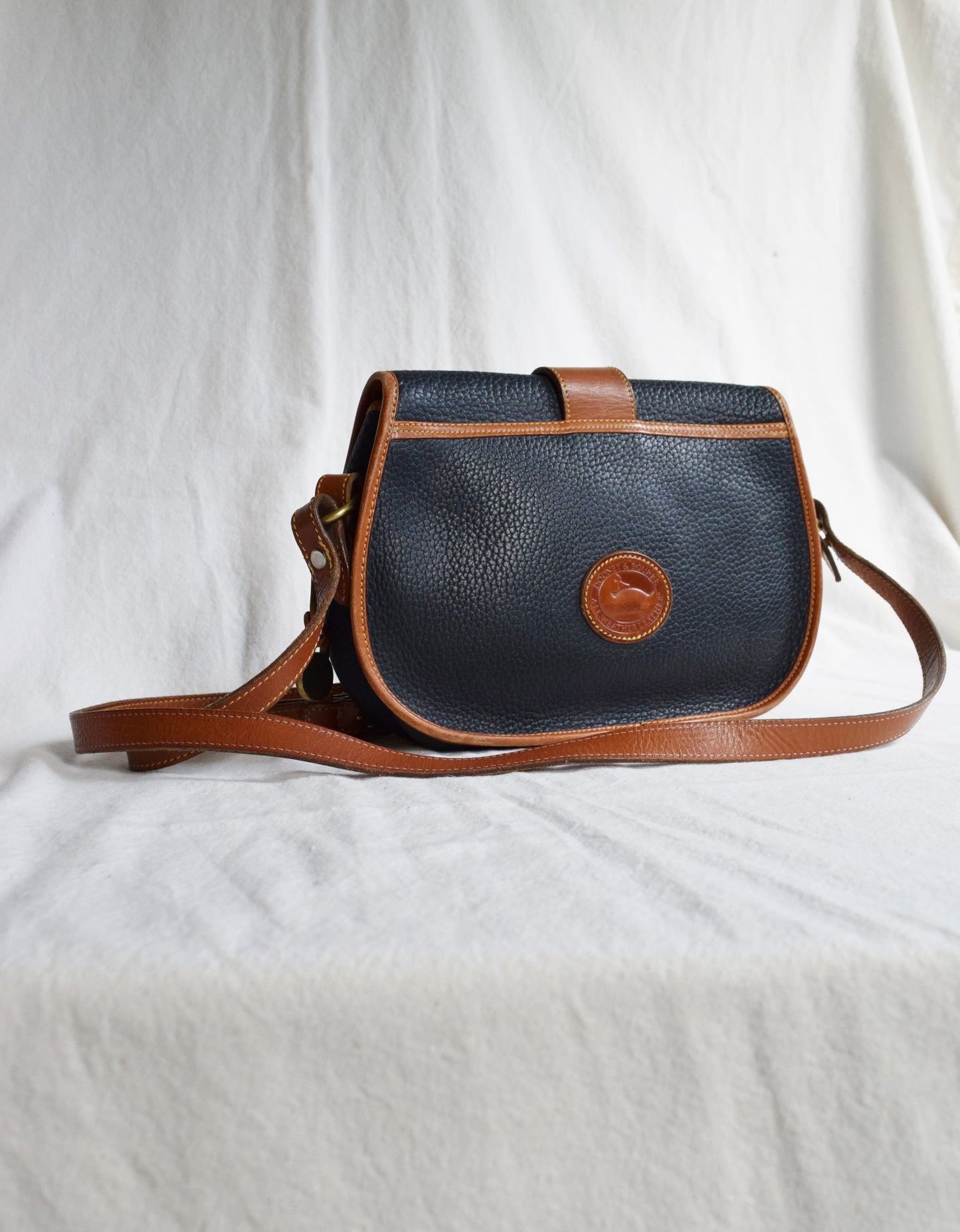 Vintage Dooney & Bourke Crossbody Saddle Bag in Navy and British Tan | All Weather Leather