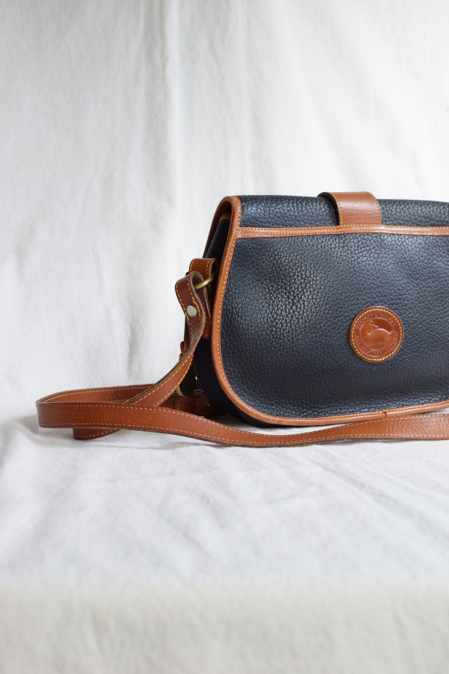 Vintage Dooney & Bourke Crossbody Saddle Bag in Navy and British Tan | All Weather Leather